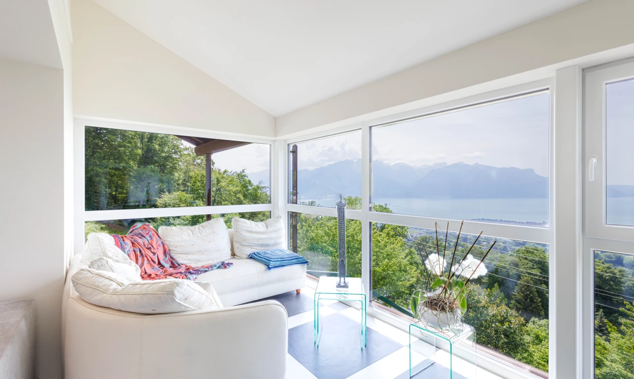 sunroom featuring vaulted ceiling and natural light