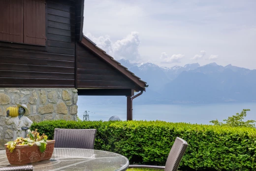view of side of home with a mountain view