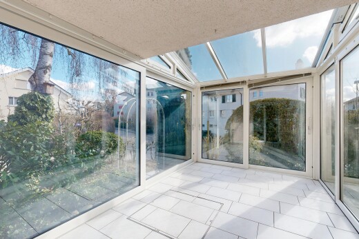 patio / terrace featuring a sunroom