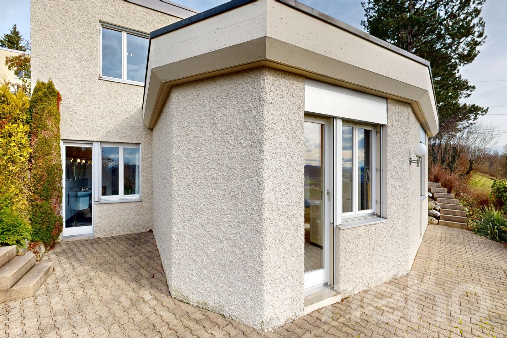 outdoor house featuring a patio and stucco siding