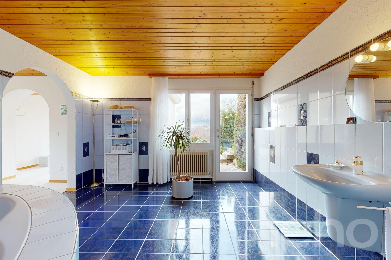 full bath with wooden ceiling, radiator heating unit, dark tile patterned floors, and a bath