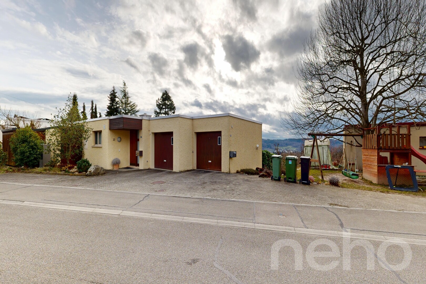 view of home featuring stucco siding and an attached garage