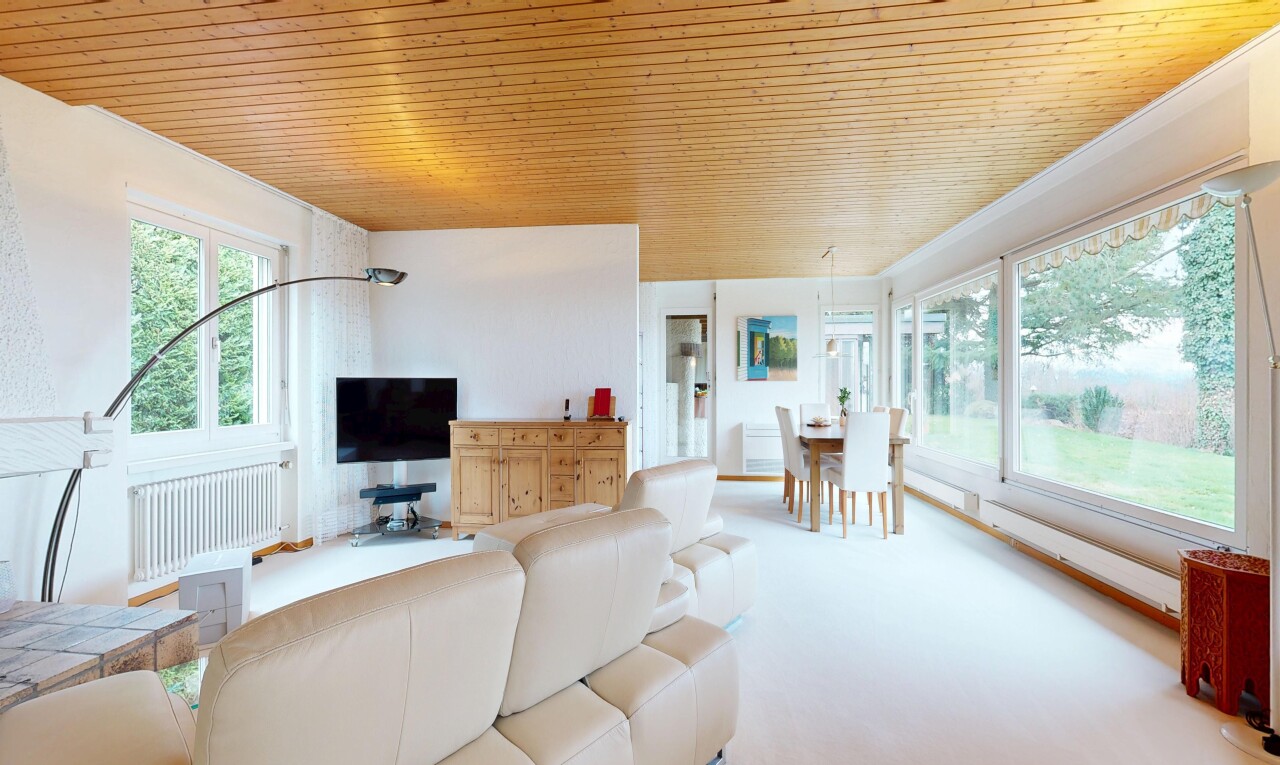 living area with radiator and wood ceiling