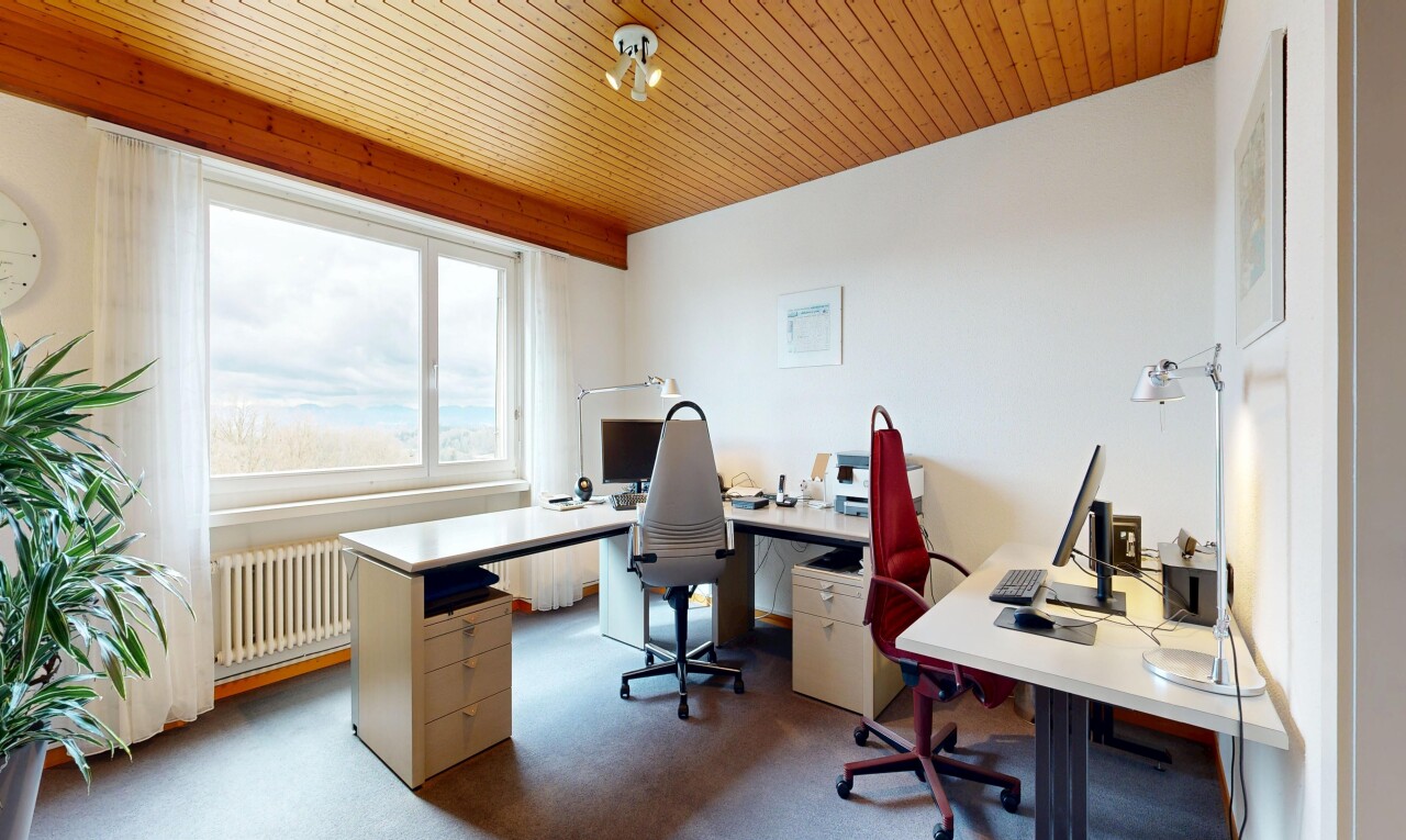 office area featuring radiator heating unit, wooden ceiling, and light carpet