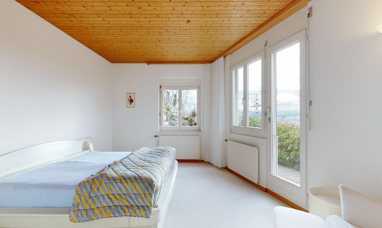 room / bedroom featuring radiator heating unit, wooden ceiling, access to outside, and light colored carpet