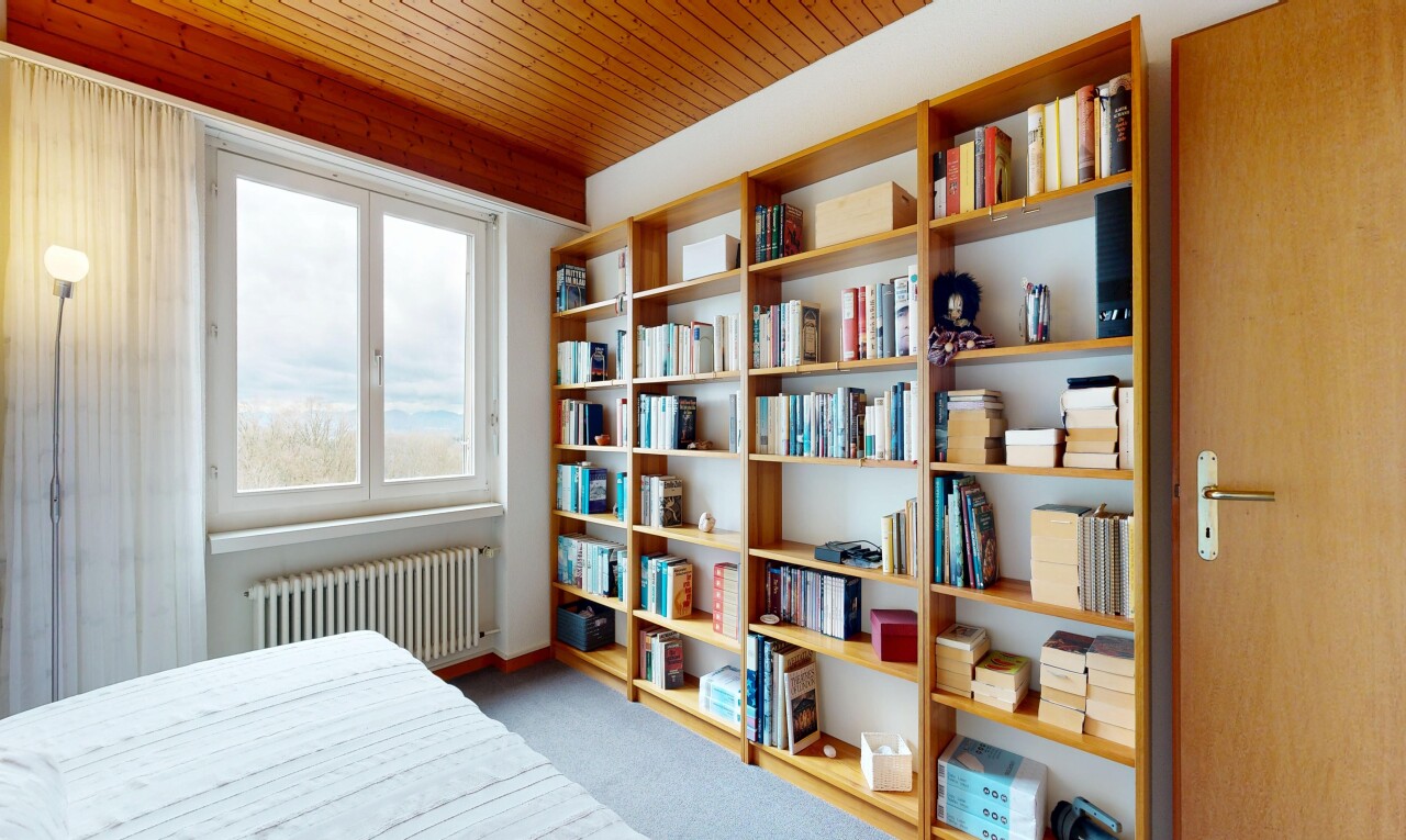 room / bedroom with radiator and light carpet