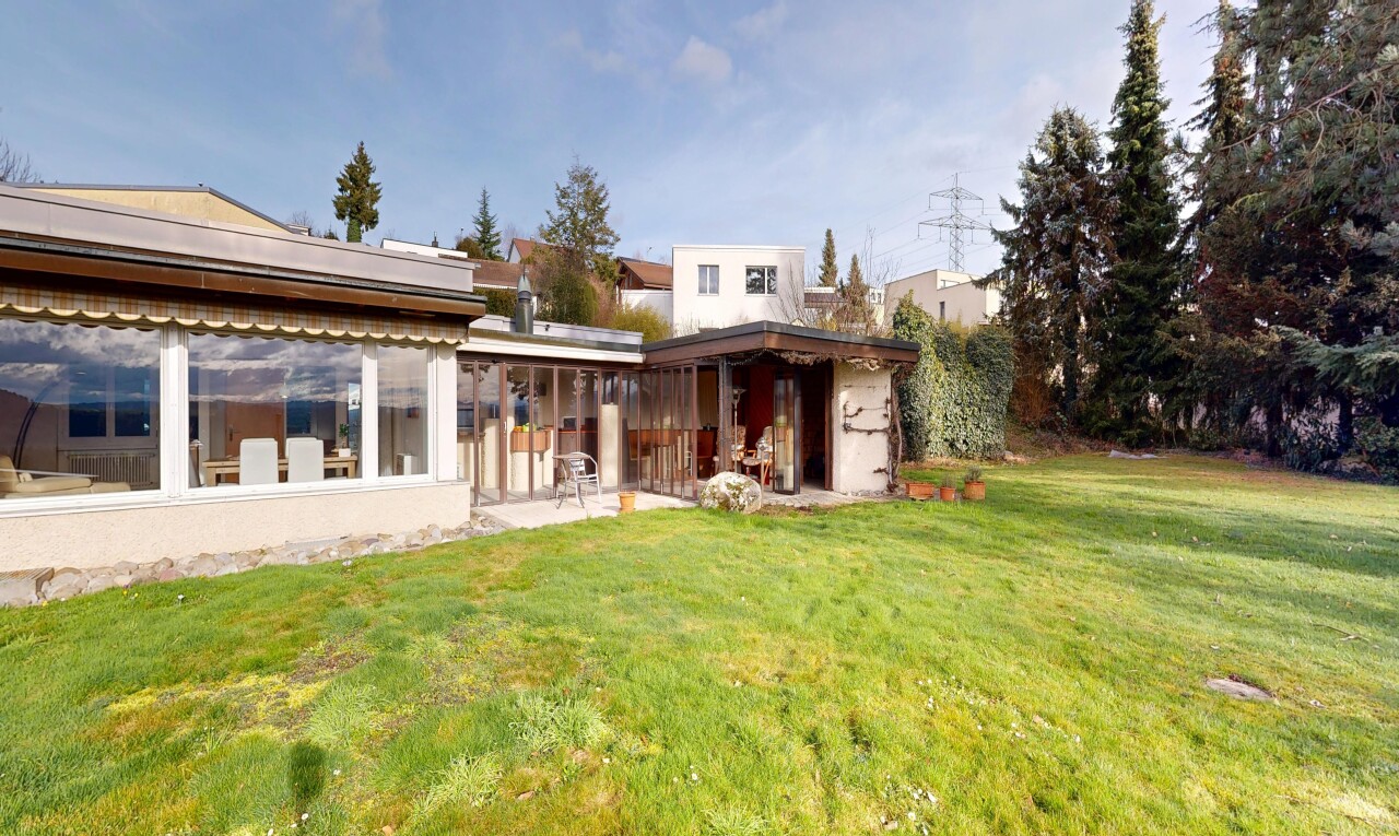 outdoor house featuring a lawn and a patio