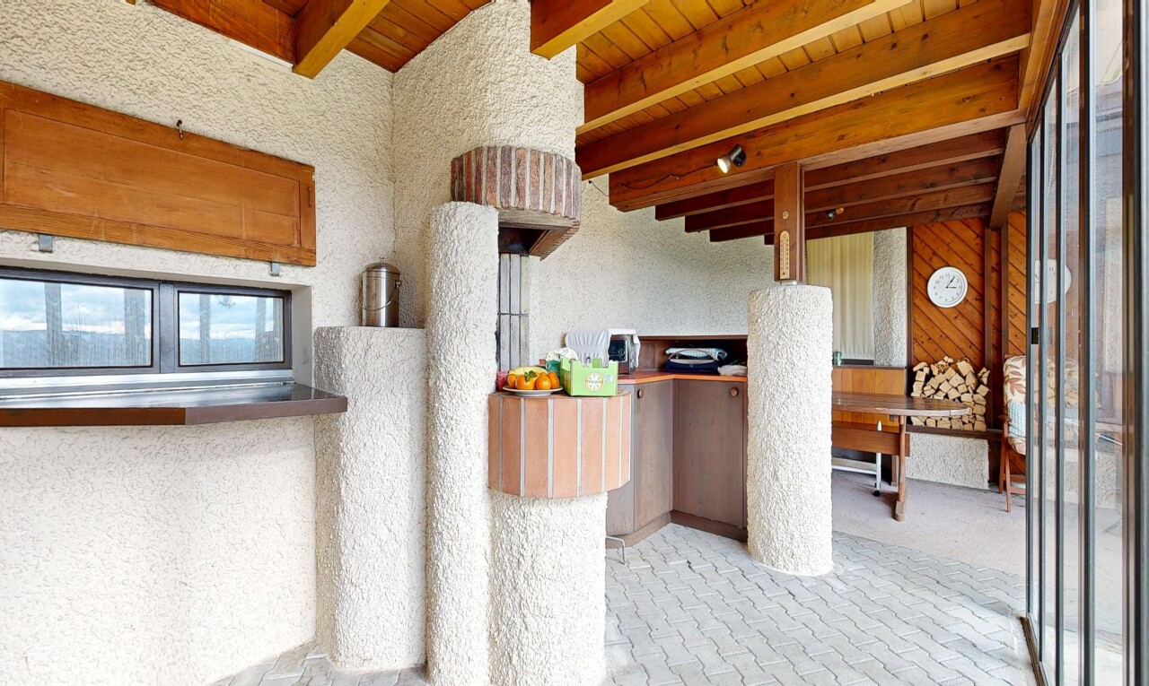 kitchen with a wood ceiling with exposed beams