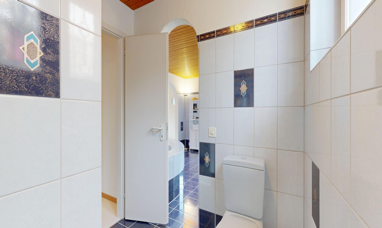 kitchen with tile walls and dark tile patterned floors