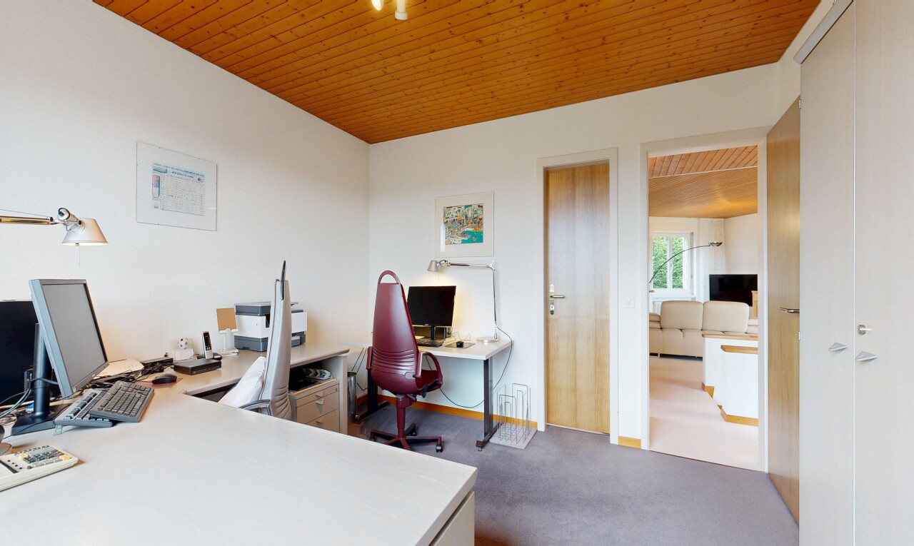 office area featuring wooden ceiling and dark carpet