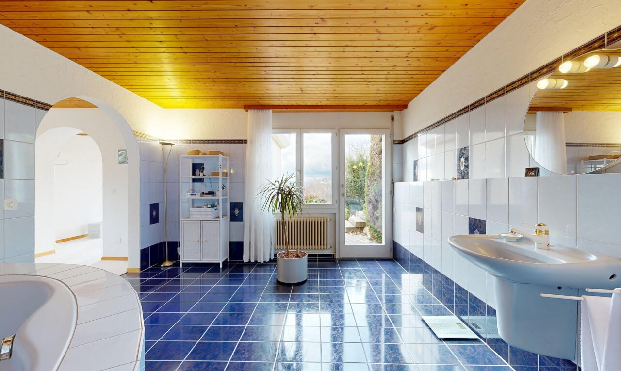 full bath with wooden ceiling, radiator heating unit, dark tile patterned floors, and a bath