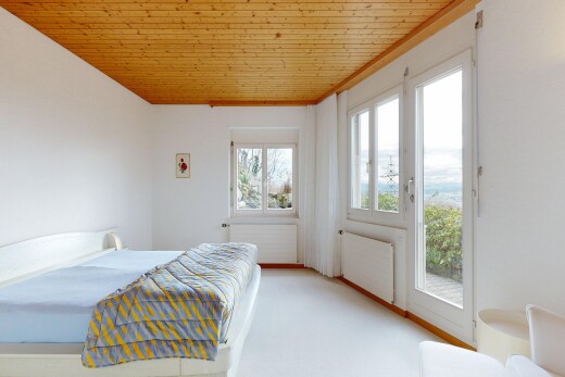 room / bedroom featuring radiator heating unit, wooden ceiling, access to outside, and light colored carpet