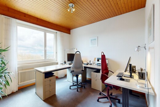 office area featuring radiator heating unit, wooden ceiling, and light carpet