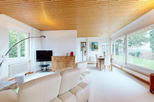 living area with radiator and wood ceiling