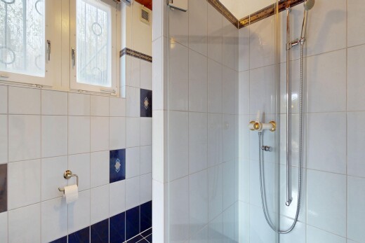 bathroom with tiled shower
