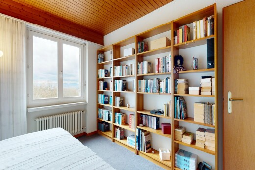 room / bedroom with radiator and light carpet