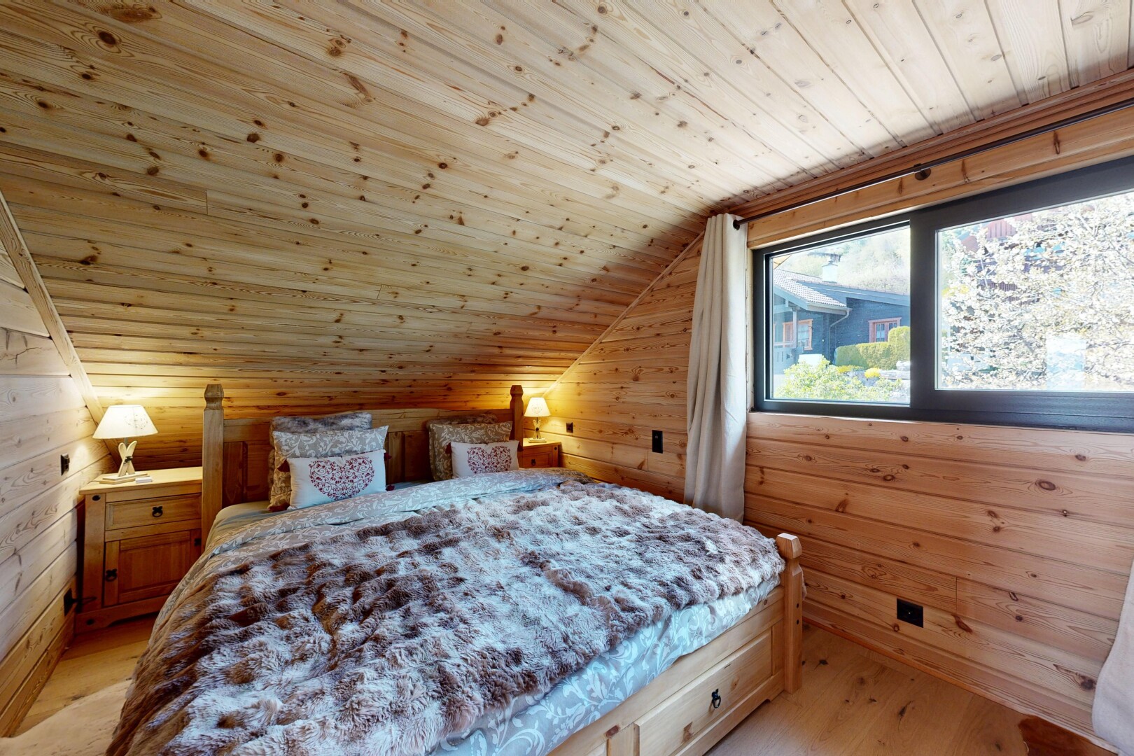 room / bedroom with wooden walls, a vaulted wooden ceiling, and light wood-style floors