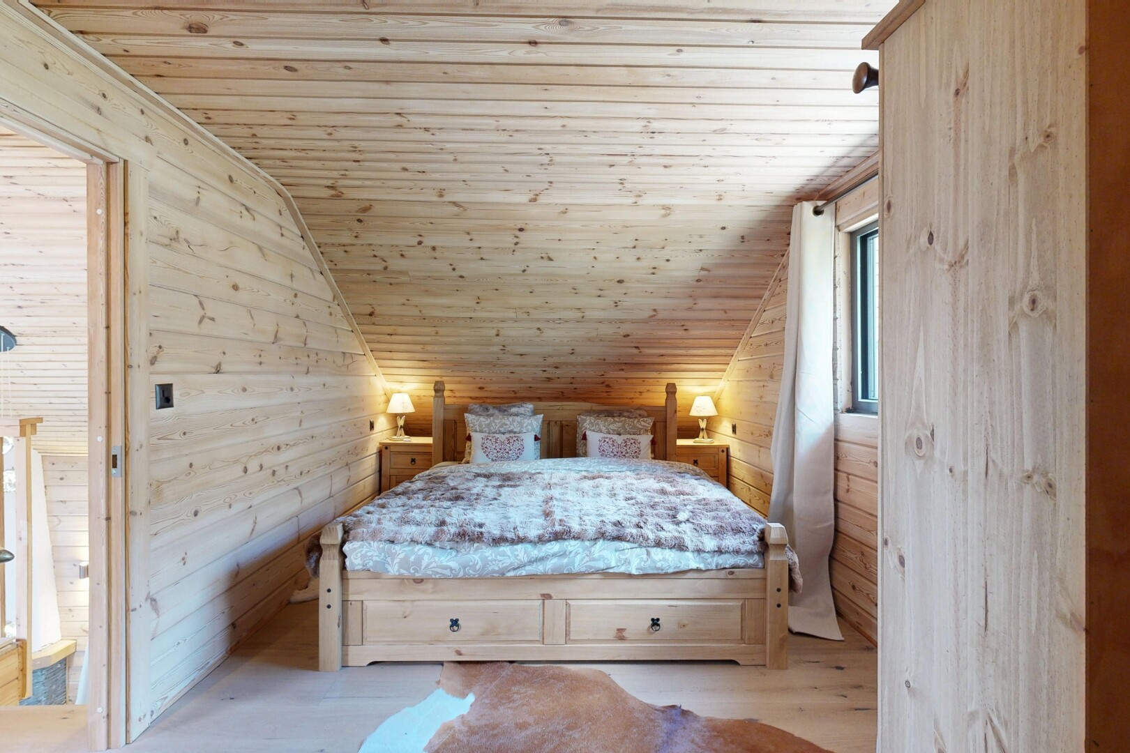 room featuring wooden walls, a vaulted wooden ceiling, and wood finished floors