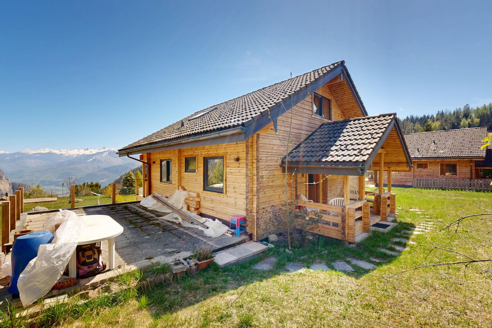 view of property with a yard and a mountain view