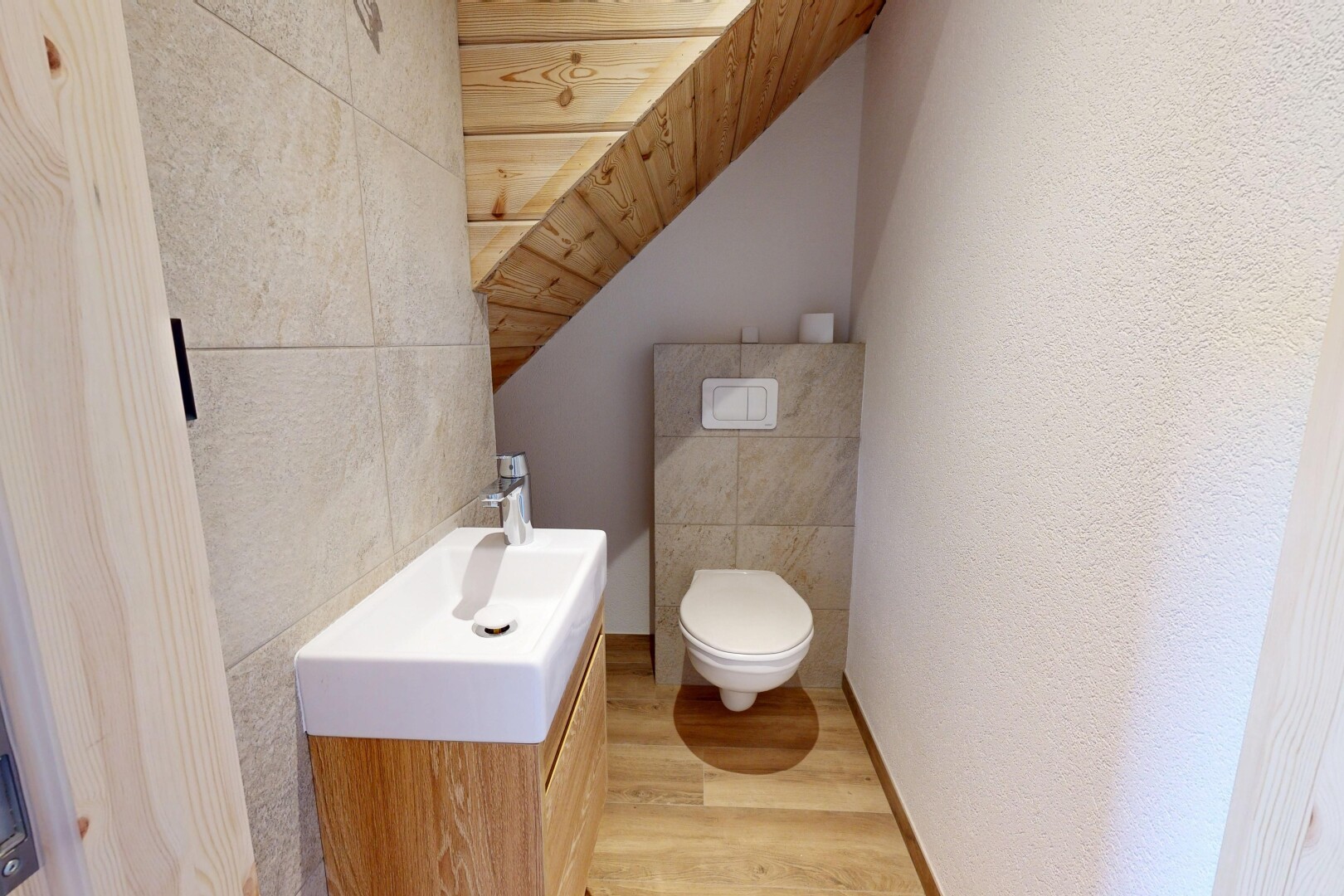 bathroom featuring light wood finished floors, a vaulted wooden ceiling, vanity, and tile walls