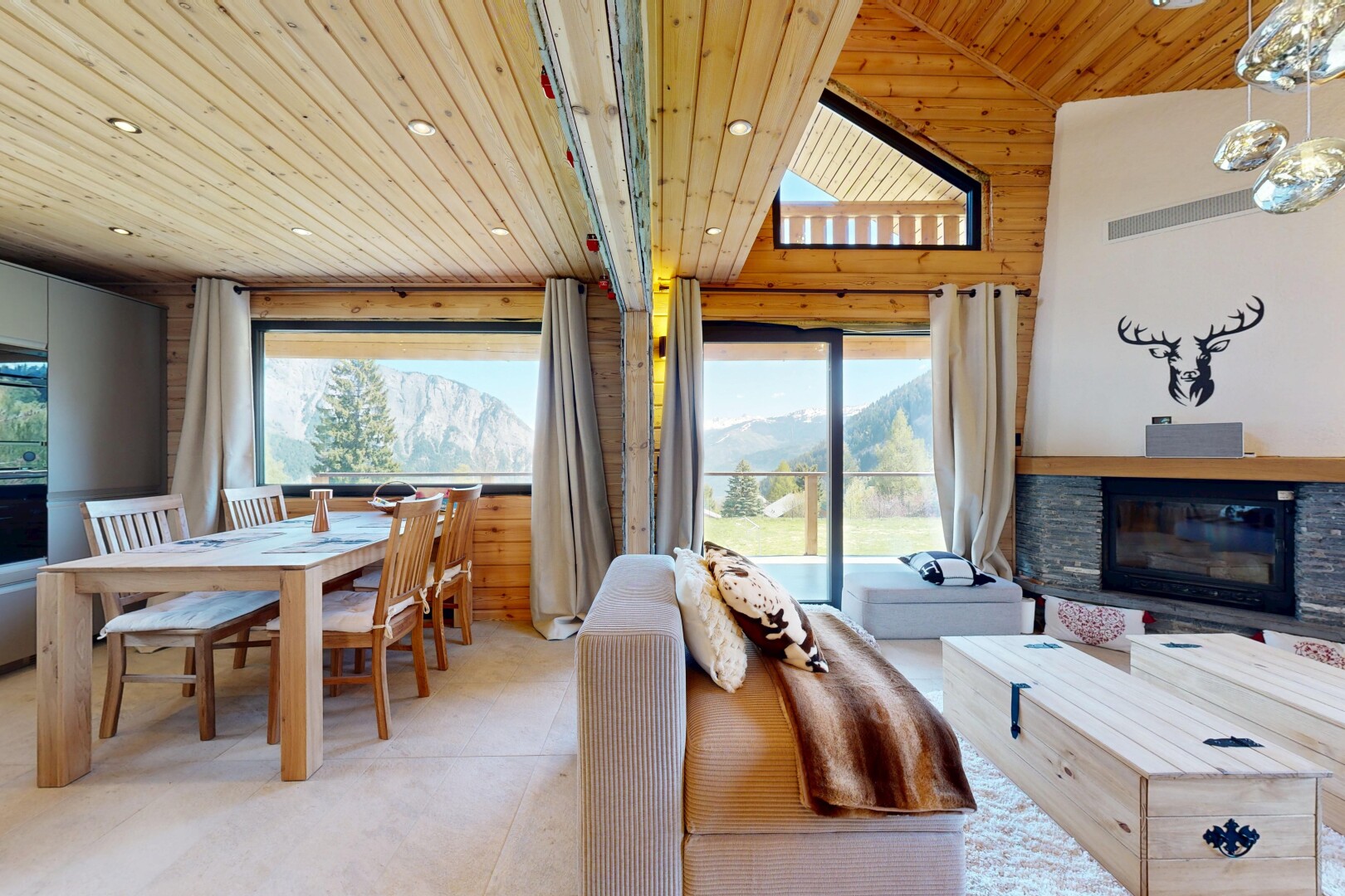 living room featuring a stone fireplace, wooden ceiling, and recessed lighting