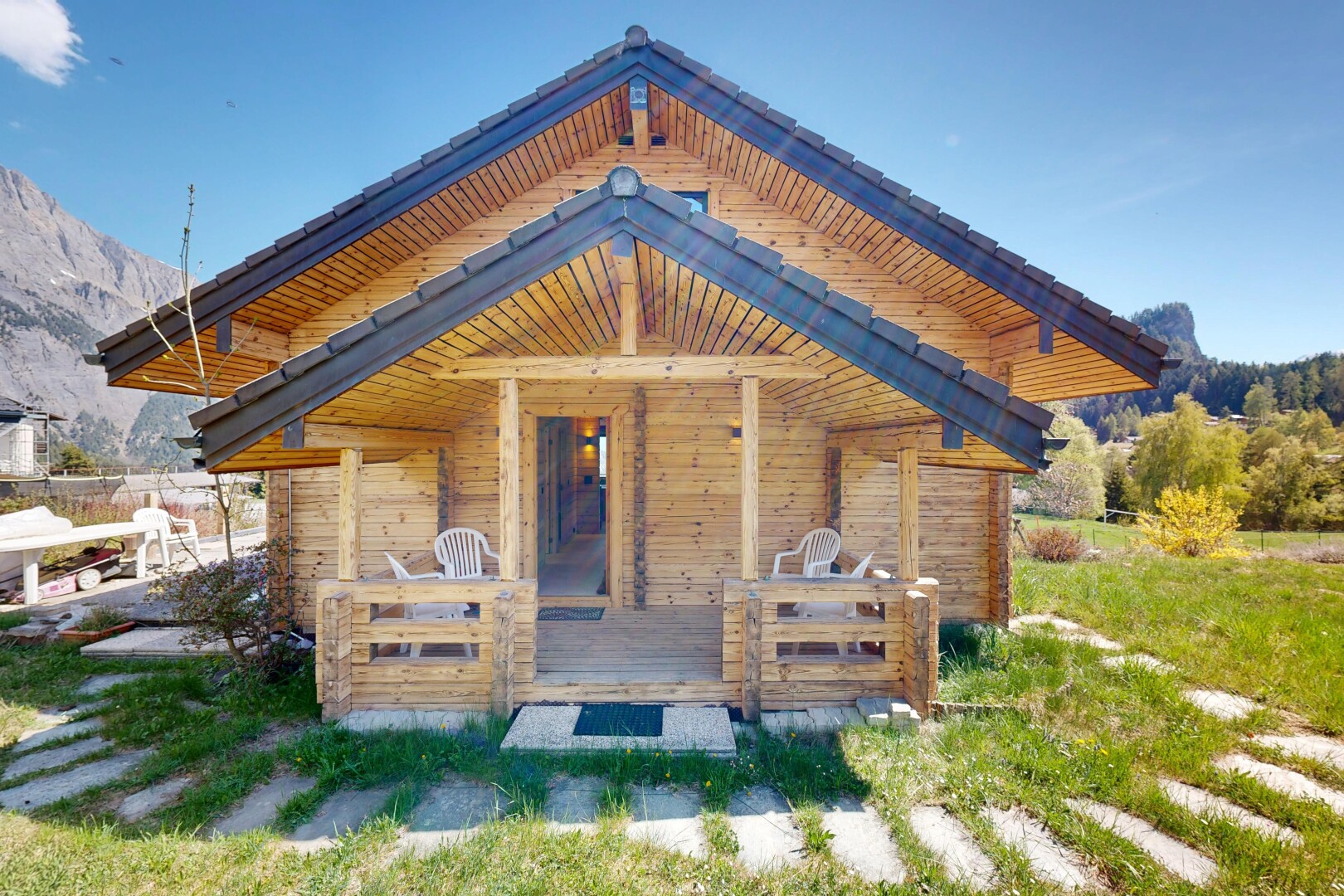 view of home with a mountain view and covered porch