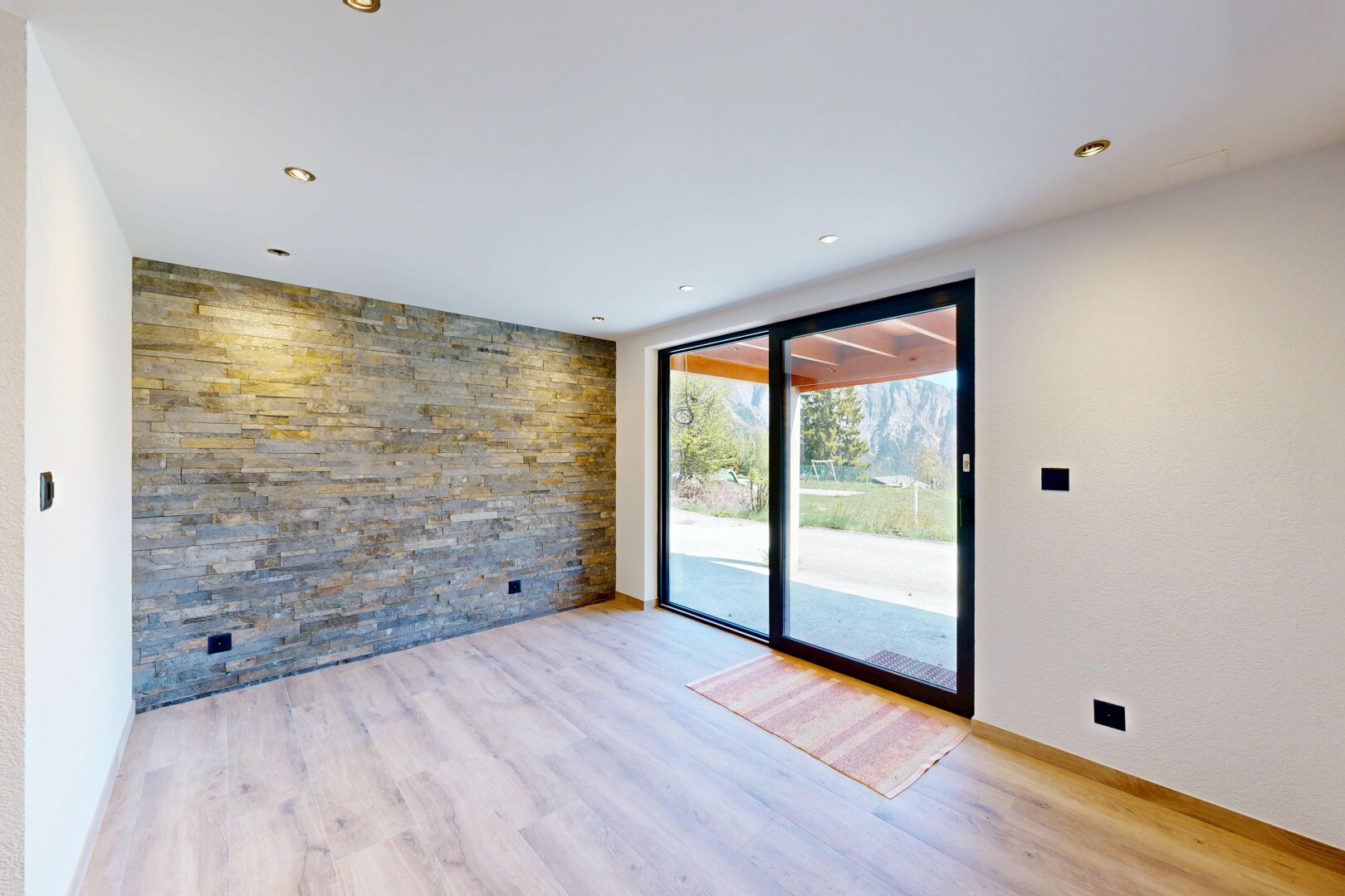 spare room featuring an accent wall, light wood-style flooring, and recessed lighting