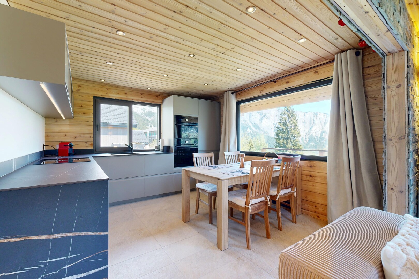 kitchen with wooden ceiling, wooden walls, modern cabinets, recessed lighting, and oven