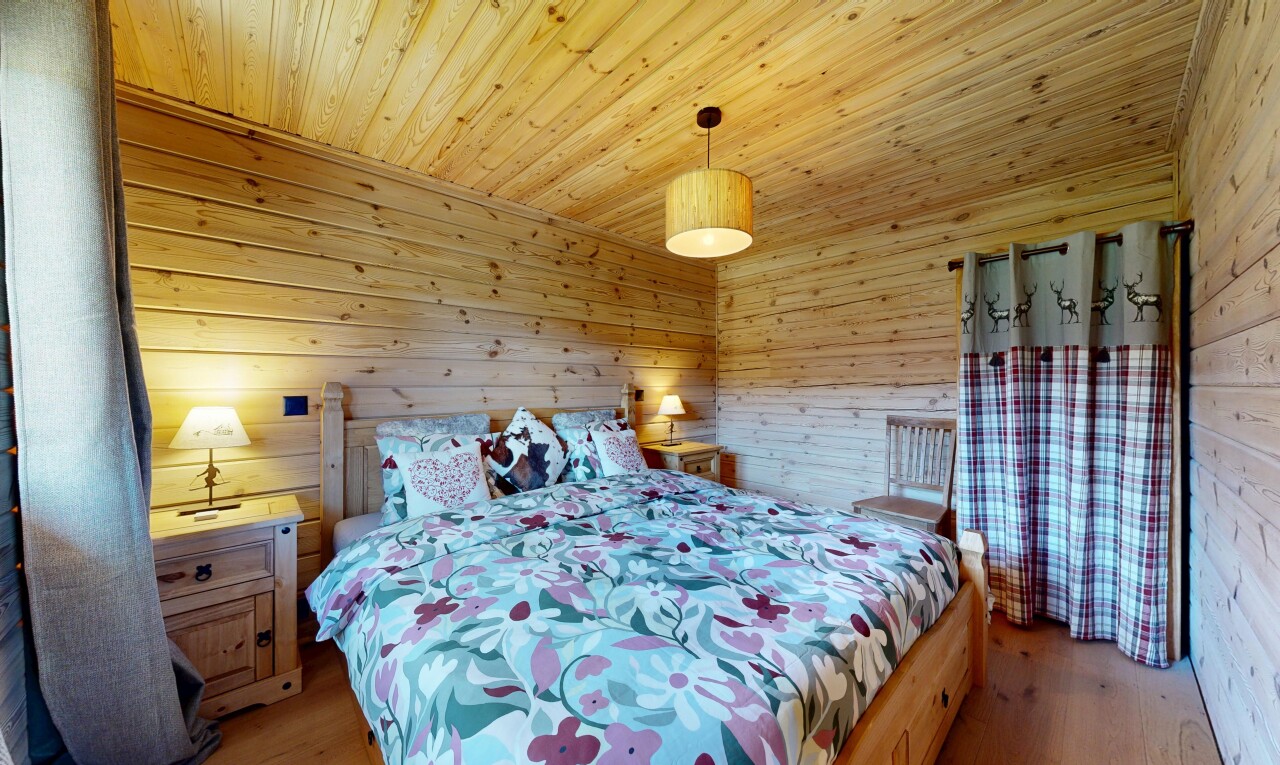 room featuring wood walls, wooden ceiling, and light wood-style flooring