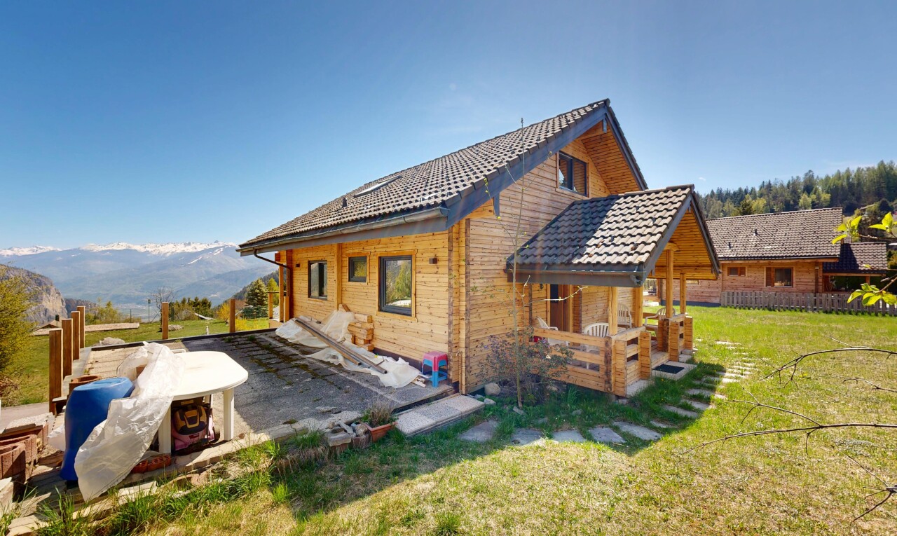 view of property with a yard and a mountain view