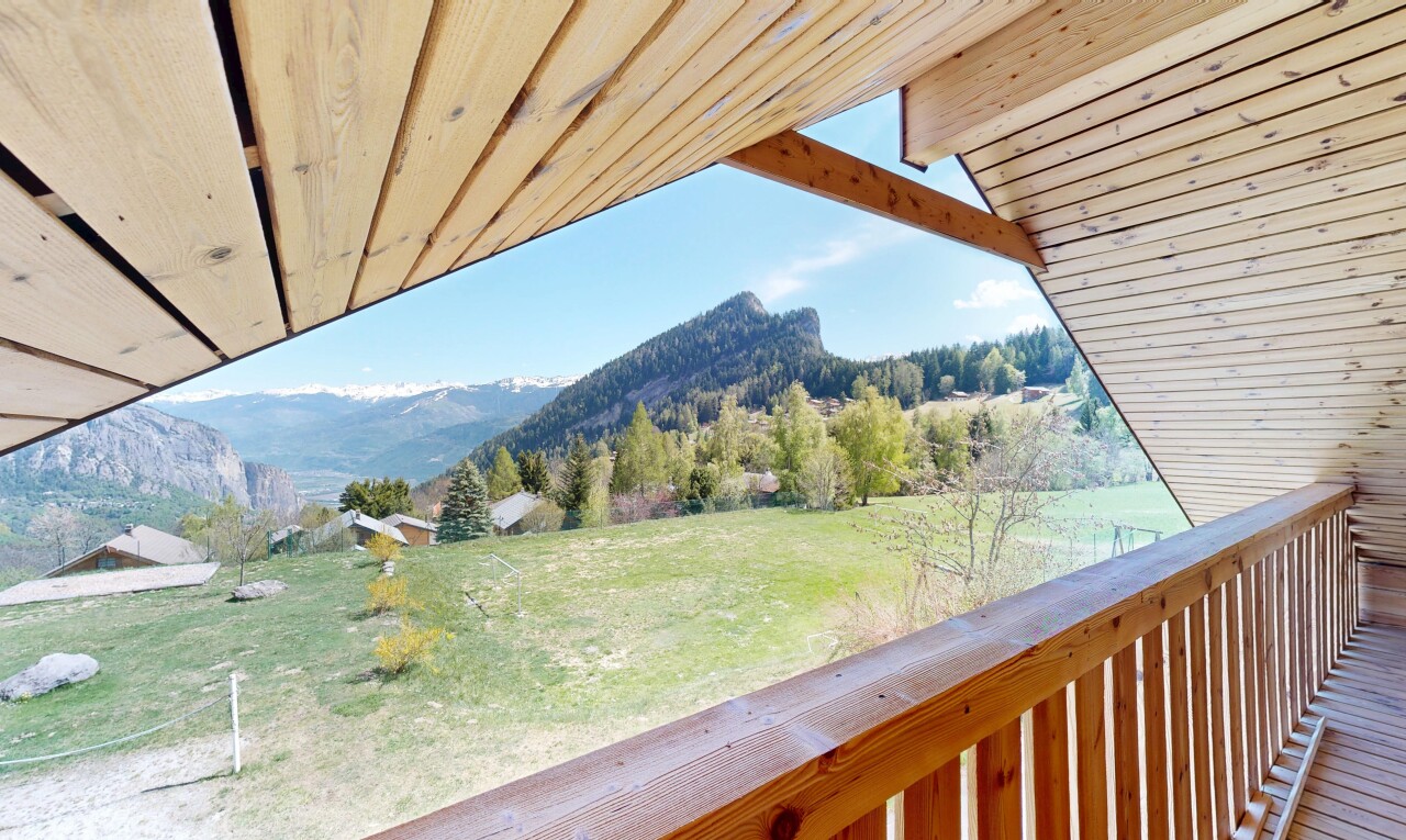 balcony with a mountain view and a view of countryside