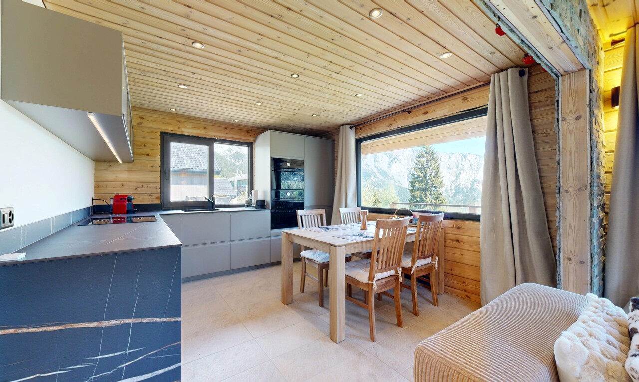 kitchen with wooden ceiling, wooden walls, modern cabinets, recessed lighting, and oven