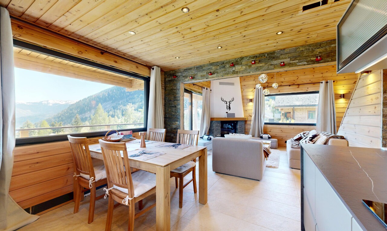 living room featuring a mountain view, recessed lighting, wooden ceiling, and wooden walls