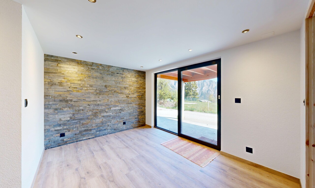 spare room featuring an accent wall, light wood-style flooring, and recessed lighting