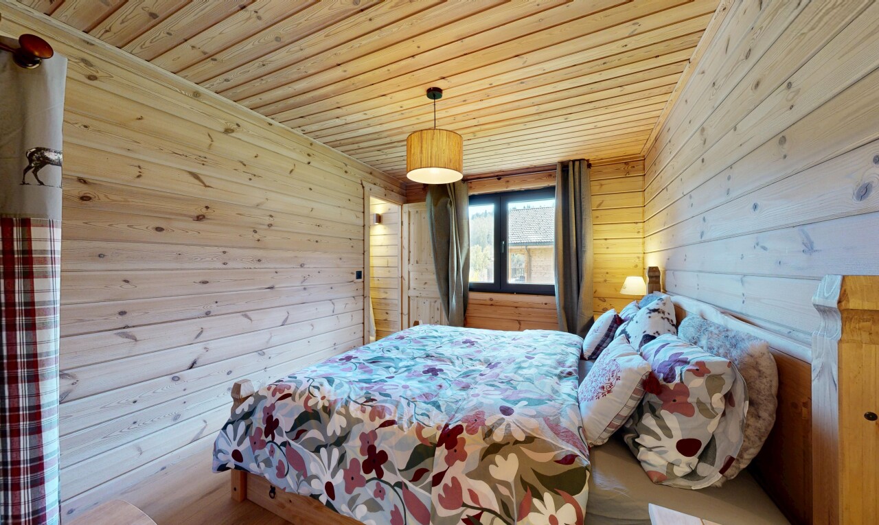 room featuring wood walls and wood ceiling