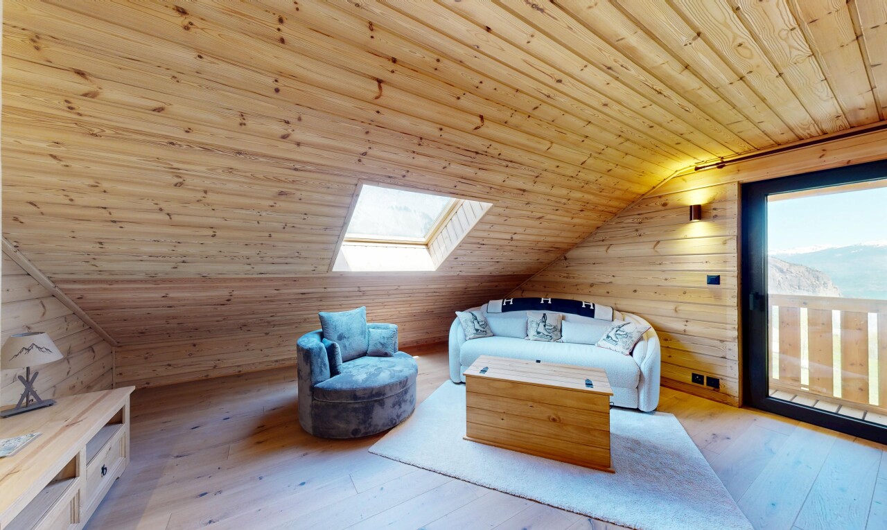 room / bedroom featuring a vaulted wood ceiling, wood walls, hardwood / wood-style floors, a skylight, and access to outside