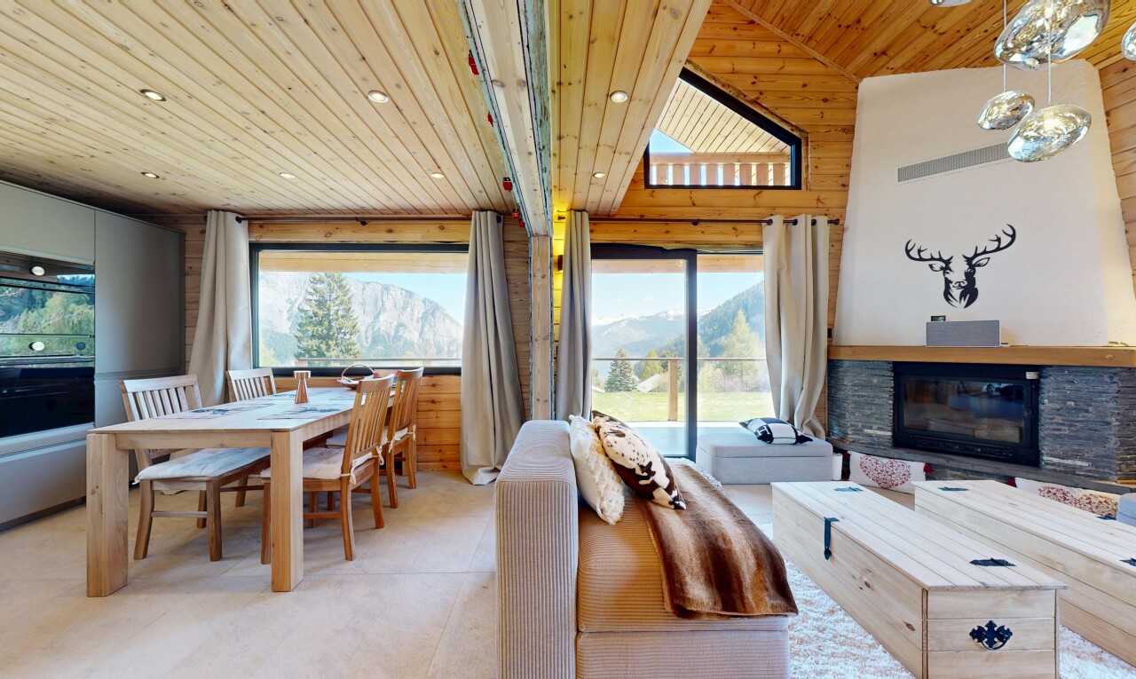 living room featuring a stone fireplace, wooden ceiling, and recessed lighting
