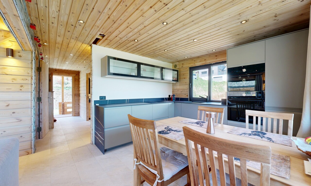 dining room with wood ceiling, wooden walls, healthy amount of natural light, recessed lighting, and light floors