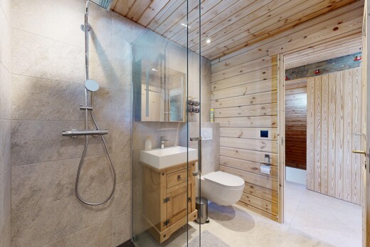 bathroom featuring vanity, wood walls, a tile shower, wood ceiling, and recessed lighting