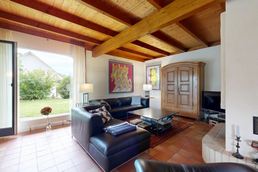 tiled living room with a wood ceiling with exposed beams