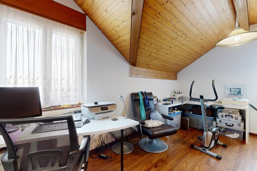 office with a vaulted wooden ceiling and wood finished floors