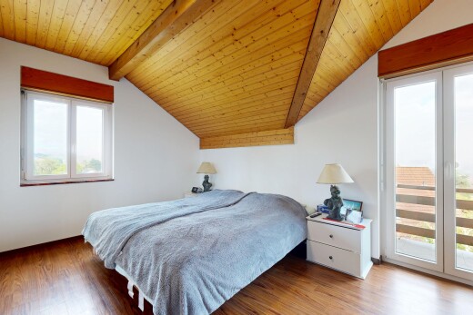 room featuring vaulted ceiling with beams, wooden ceiling, wood finished floors, and access to outside