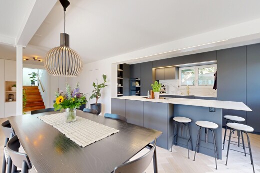 dining area with stairs and light wood-style flooring