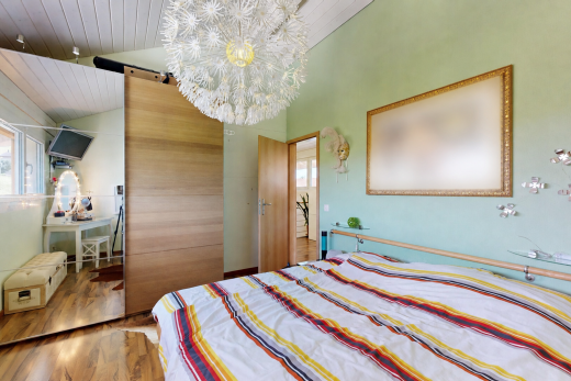 room / bedroom featuring wood finished floors, a vaulted wooden ceiling, and suspended lighting