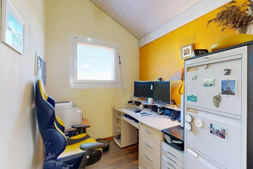 office featuring lofted ceiling and dark wood-type flooring
