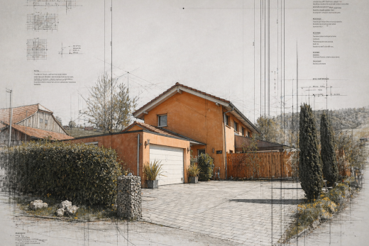 view of home featuring decorative driveway and stucco siding