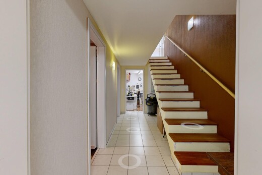 staircase with tile patterned flooring