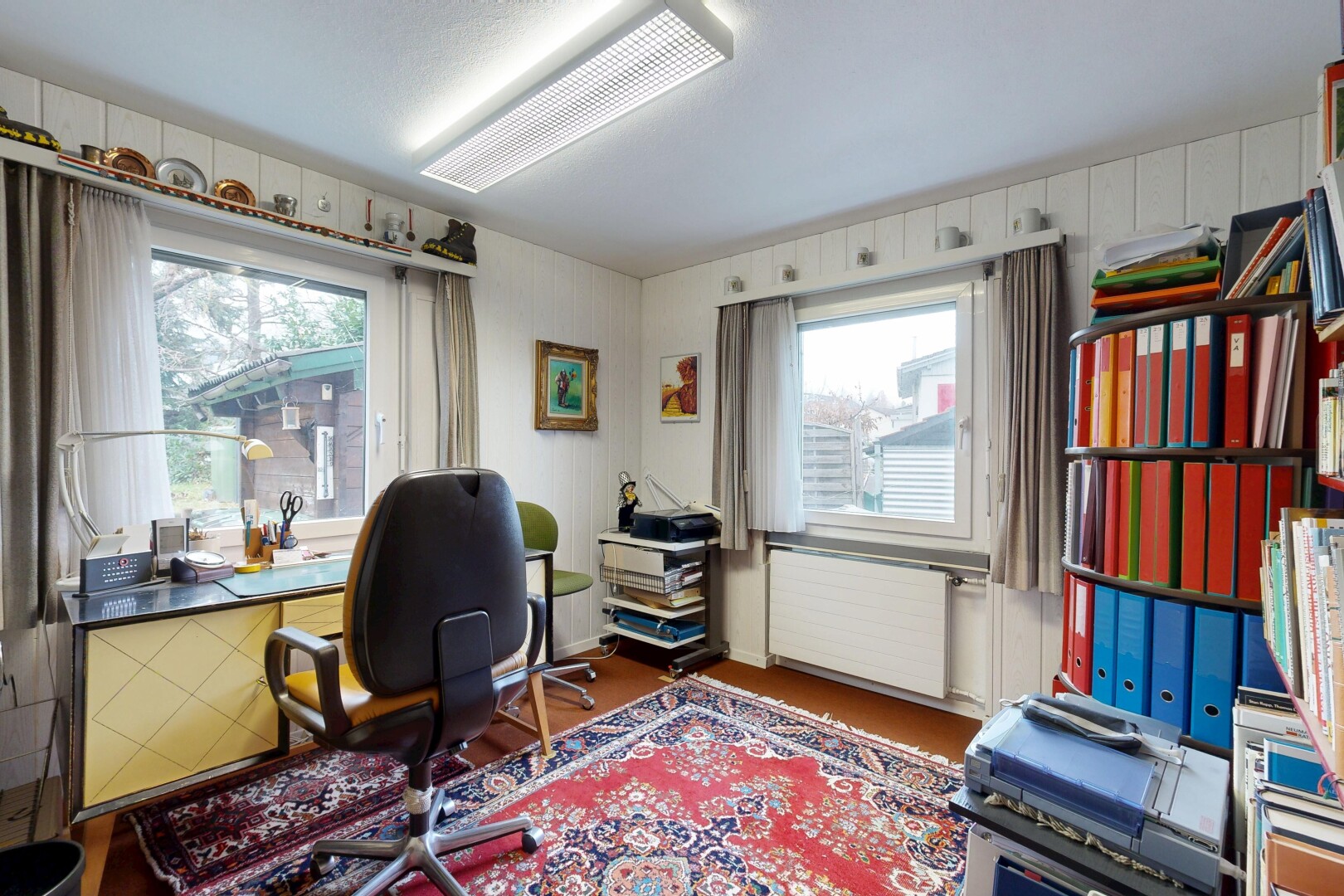 office area featuring radiator and wood finished floors