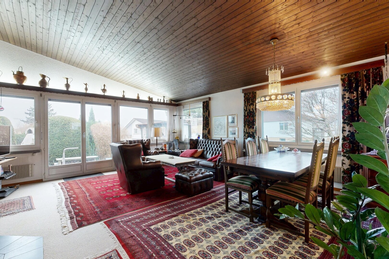 living area with vaulted ceiling, wooden ceiling, and radiator heating unit