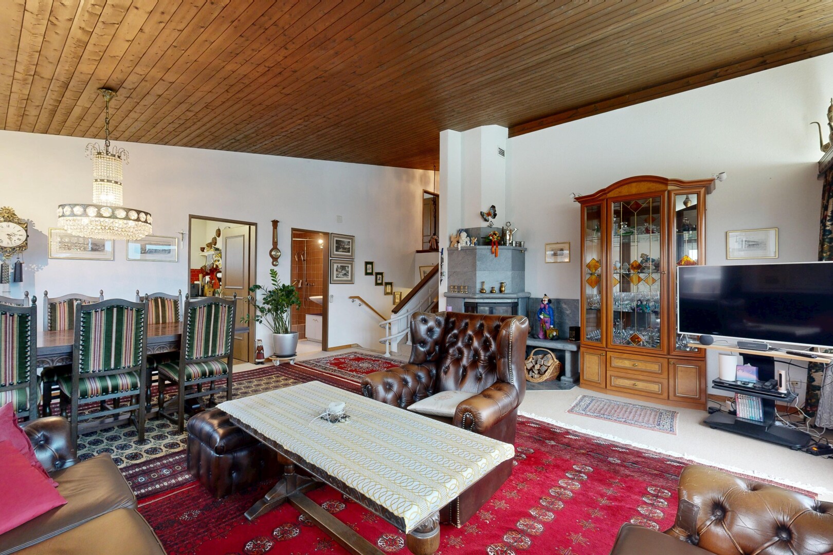 living area featuring stairway and wood ceiling